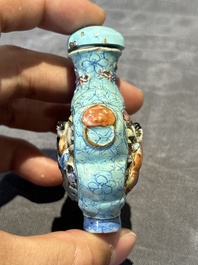 Eight Chinese moulded famille rose snuff bottles, Qianlong mark, 19th C.
