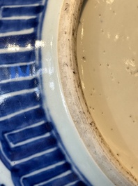 A Chinese blue and white 'flower scroll' jar with a wooden cover, Qianlong