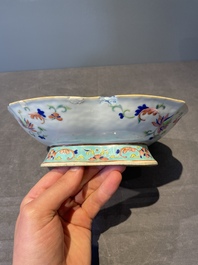 A Chinese blue, white and famille rose tea service, three famille rose bowls, a plate and a covered jar, 19th C.