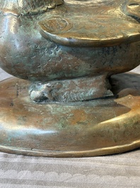 A large bronze sculpture and an opium weight in shape of Hintha or Hamsa, Burma/India, 17/18th C.