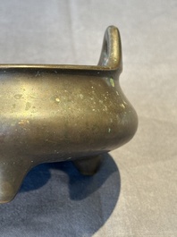 A Chinese bronze tripod censer, Guan Huai Tang Zhu Ren 冠槐堂主人 mark, 17/18th C.