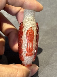 A group of seven Chinese red-overlay glass and red glass snuff bottles, 19/20th C.