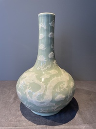A Chinese celadon-ground slib design 'dragon' vase and Chinese blue and white vase or incense container, 19th C.