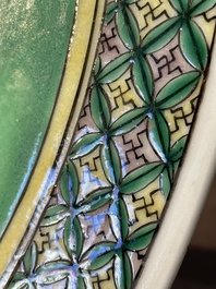 A Chinese famille verte and a famille rose dish with birds among blossom branches, 19th C.