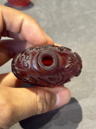 A group of seven Chinese red-overlay glass and red glass snuff bottles, 19/20th C.