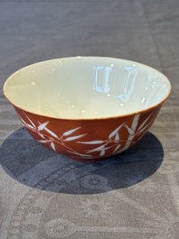 A Chinese coral-red-glazed bowl with reverse-decorated bamboo design, Xuantong mark and of the period