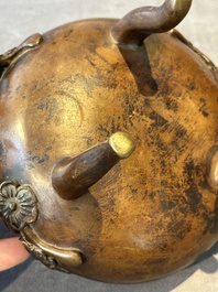 Two Chinese Chinese bronze cylindrical incense stick holders and a covered censer, Yuan/Ming and Qing