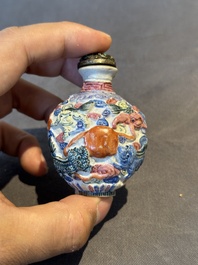 Six Chinese moulded famille rose snuff bottles, Qianlong mark, 19th C.