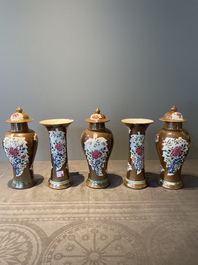 A Chinese capucin-brown-ground famille rose garniture of five vases with floral design, Qianlong