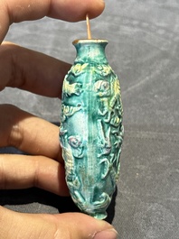 Eight Chinese moulded famille rose snuff bottles, Qianlong mark, 19th C.