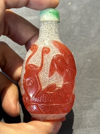 A group of seven Chinese red-overlay glass and red glass snuff bottles, 19/20th C.