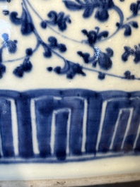 A Chinese blue and white 'flower scroll' jar with a wooden cover, Qianlong