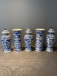 A Chinese blue and white garniture of five vases with lotus scrolls, 19th C.