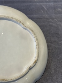 A Chinese blue and white 'butterfly' cup and saucer with applied floral design, Qianlong