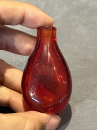 A group of seven Chinese red-overlay glass and red glass snuff bottles, 19/20th C.