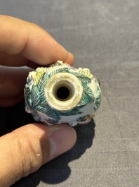 A Chinese famille rose moulded snuff bottle, Qianlong mark, late 18th/early 19th C.