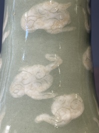A Chinese celadon-ground slib design 'dragon' vase and Chinese blue and white vase or incense container, 19th C.