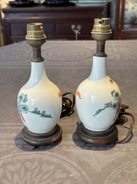 A pair of Chinese famille rose vases with figural design mounted as lamps, 19th C.