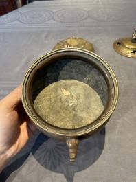 A Chinese bronze tripod censer with cover and stand, 19th C.