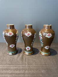 A Chinese capucin-brown-ground famille rose garniture of five vases with floral design, Qianlong