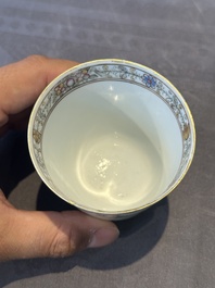 A Chinese famille rose 'erotic subject' cup and saucer, Yongzheng/Qianlong