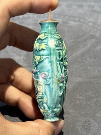 Eight Chinese moulded famille rose snuff bottles, Qianlong mark, 19th C.