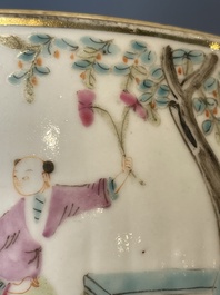A pair of Chinese famille rose jars and covers with figures in a garden, Tongzhi mark and of the period