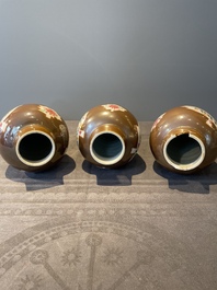 A Chinese capucin-brown-ground famille rose garniture of five vases with floral design, Qianlong