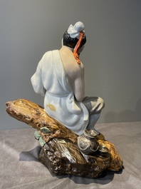 A Chinese polychrome sculpture of a lumberjack, Jingdezheng mark, 20th C.