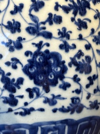 A Chinese blue and white 'flower scroll' jar with a wooden cover, Qianlong