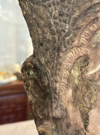 A Thai red sandstone head of Buddha and a lacquered and gilt stone head of Buddha, possibly Ayutthaya period, 15th C.