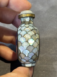 Two Chinese lacquered and mother-of-pearl-inlaid snuff bottles and a carved mother-of-pearl shell snuff bottle, Qianlong mark, 18/19th C