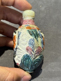 Eight Chinese moulded famille rose snuff bottles, Qianlong mark, 19th C.