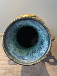 A pair of Chinese robin's egg and faux bronze-glazed 'hu' vases, Qianlong mark, 19th C.