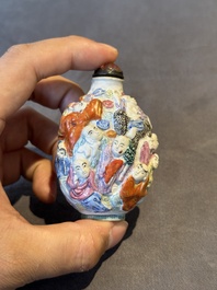 Six Chinese moulded famille rose snuff bottles, Qianlong mark, 19th C.