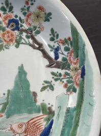 A Chinese famille verte 'leaping carps' dish, artemisia leaf mark, Kangxi
