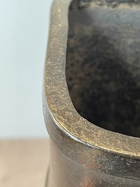 A pair of Chinese bronze 'hu' vases with Taotie design, Song/Yuan