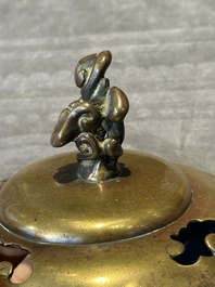 A Chinese bronze tripod censer with cover and stand, 19th C.