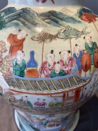 A pair of Chinese famille rose 'hundred boys' vases and covers on wooden stands, 19th C.
