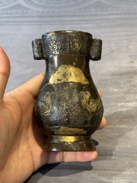 Four Chinese archaistic gilt bronze vases, Yuan/Ming