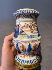 A pair of Chinese Imari-style casters or vases with gilt bronze mounts, Kangxi