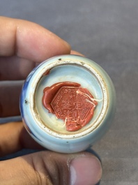 A Chinese blue, white and copper-red snuff bottle, 19th C.