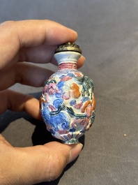 Six Chinese moulded famille rose snuff bottles, Qianlong mark, 19th C.