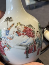A pair of Chinese famille rose vases with figural design mounted as lamps, 19th C.
