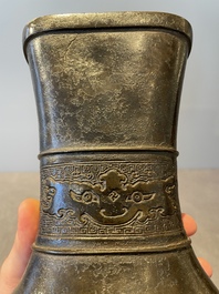 A pair of Chinese bronze 'hu' vases with Taotie design, Song/Yuan
