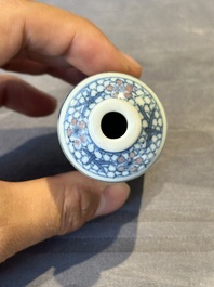 A Chinese blue, white and copper-red snuff bottle, Kangxi mark, 19th C.