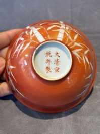 A Chinese coral-red-glazed bowl with reverse-decorated bamboo design, Xuantong mark and of the period