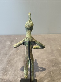 A group of seven bronze and pottery objects, Syria, Persia, and Luristan, 3rd C. and earlier