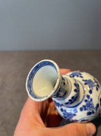 A Chinese blue and white vase, a covered bowl and six saucers, Chenghua and artemisia leaf mark, Kangxi