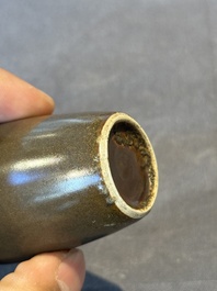 A rare Chinese monochrome teadust-glazed snuff bottle with a bronze 'dragon' stopper, 18/19th C.